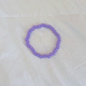 Kids droopy purple bracelet | made with elastic string and round beads